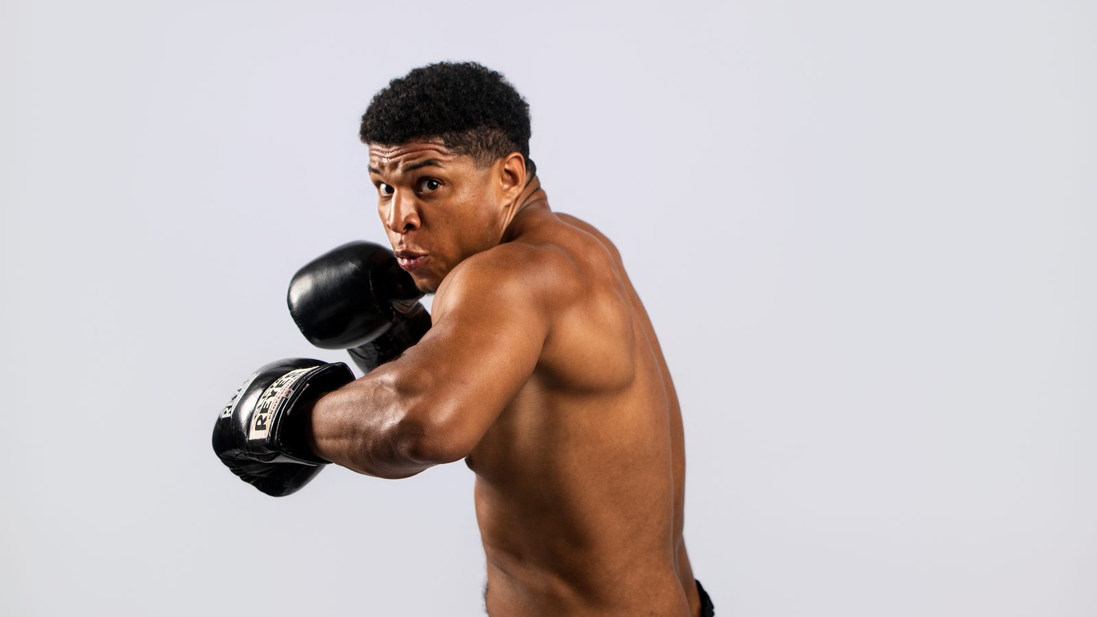 Cody Brooks throwing a punch, studio shot